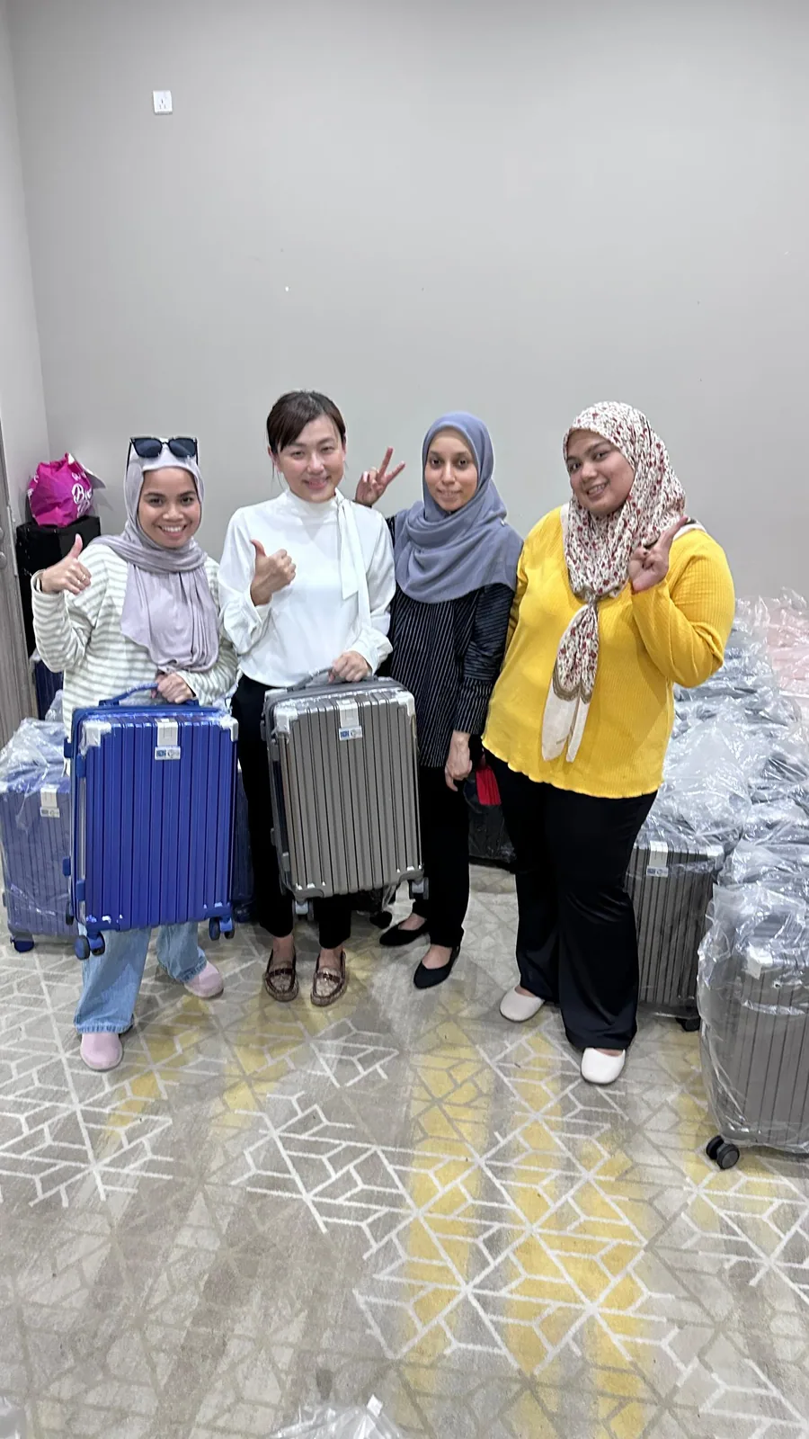 Three women from Koperasi TNB with their new KIYO cases