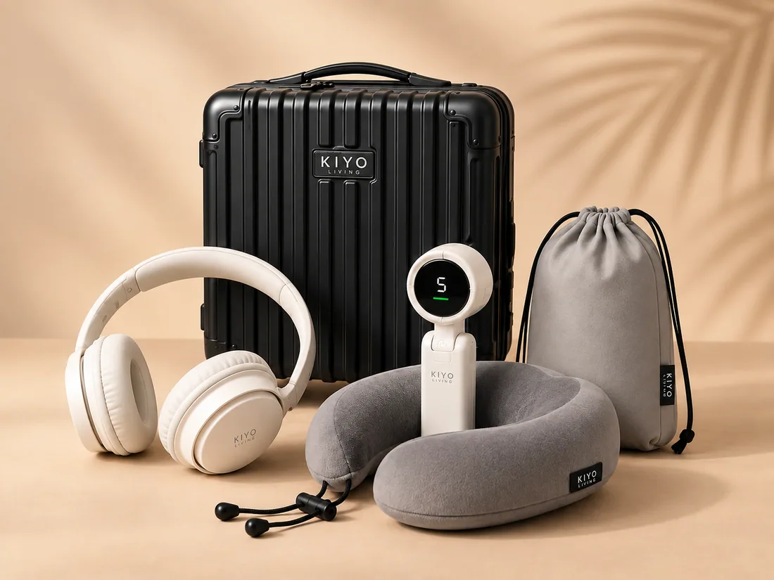 The Travel Comfort Set: a black mini hard case with headphones, a neck pillow, a portable fan and a pouch